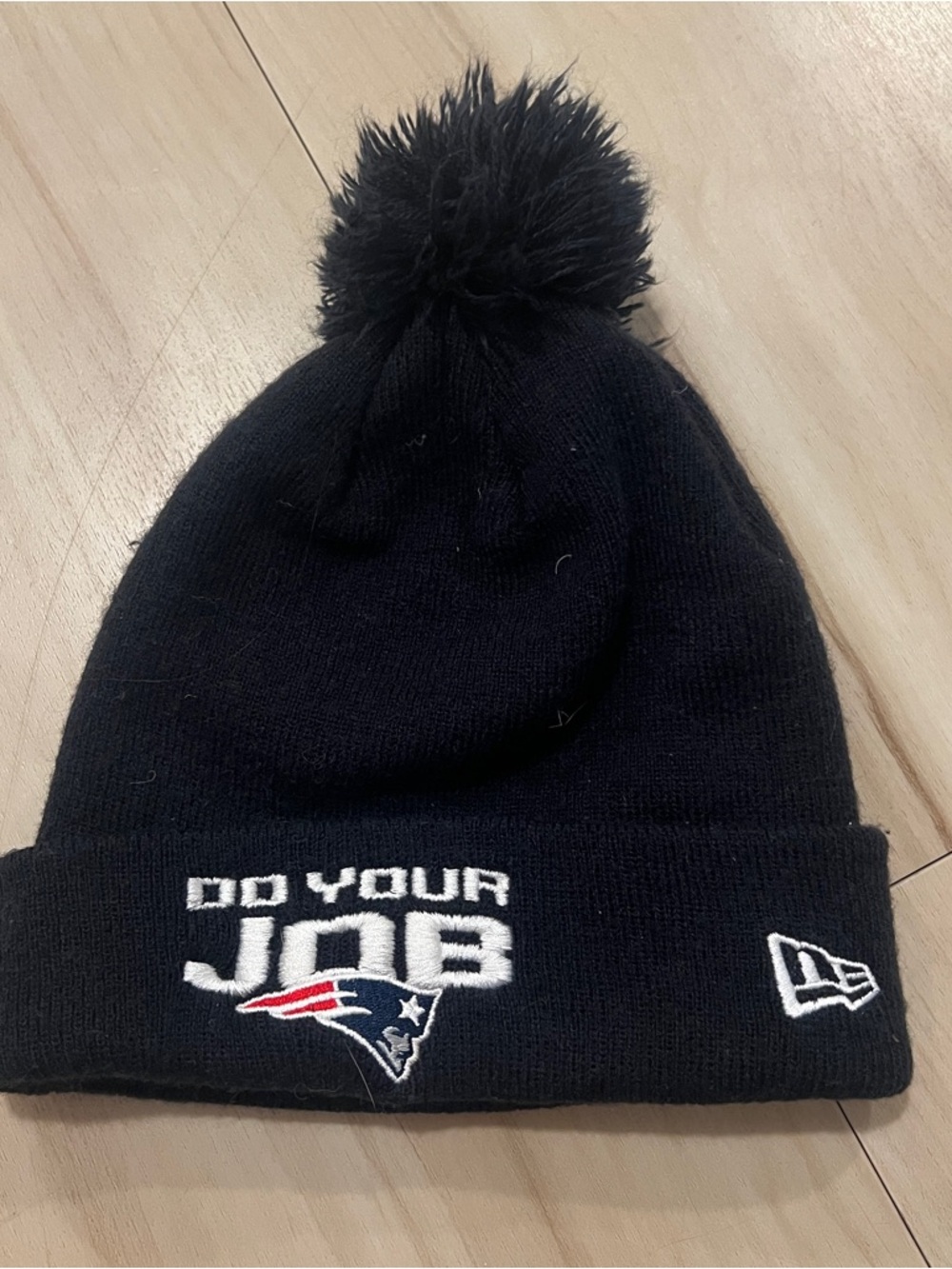 New Era Black “Do Your Job” New England Patriots Knit Beanie